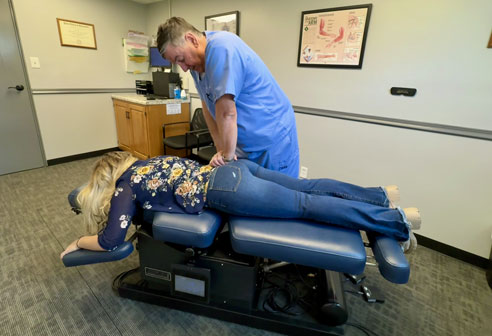 Doctor adjusting patient