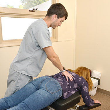 Doctor adjusting female patient